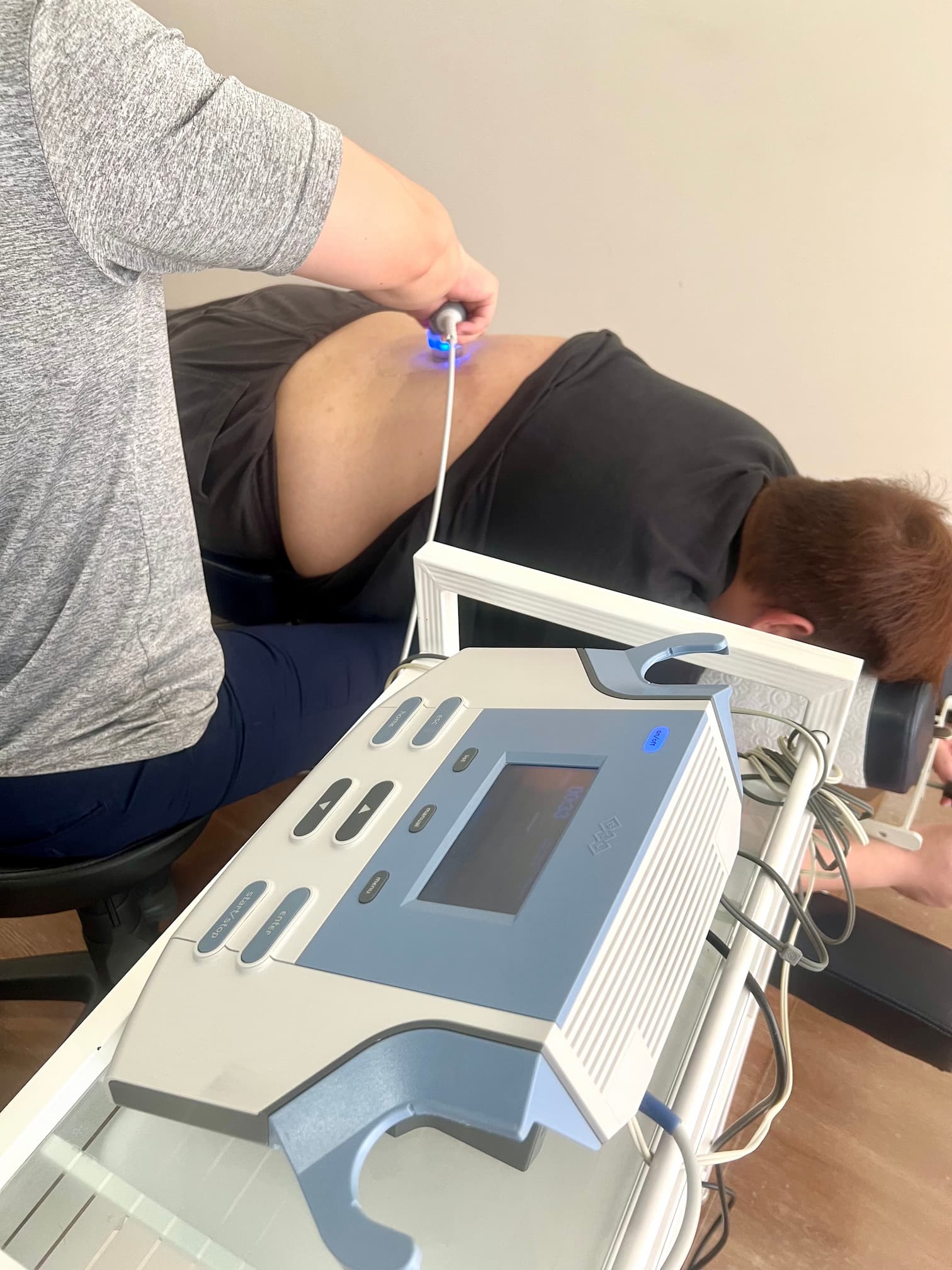 electrotherapy being performed on man