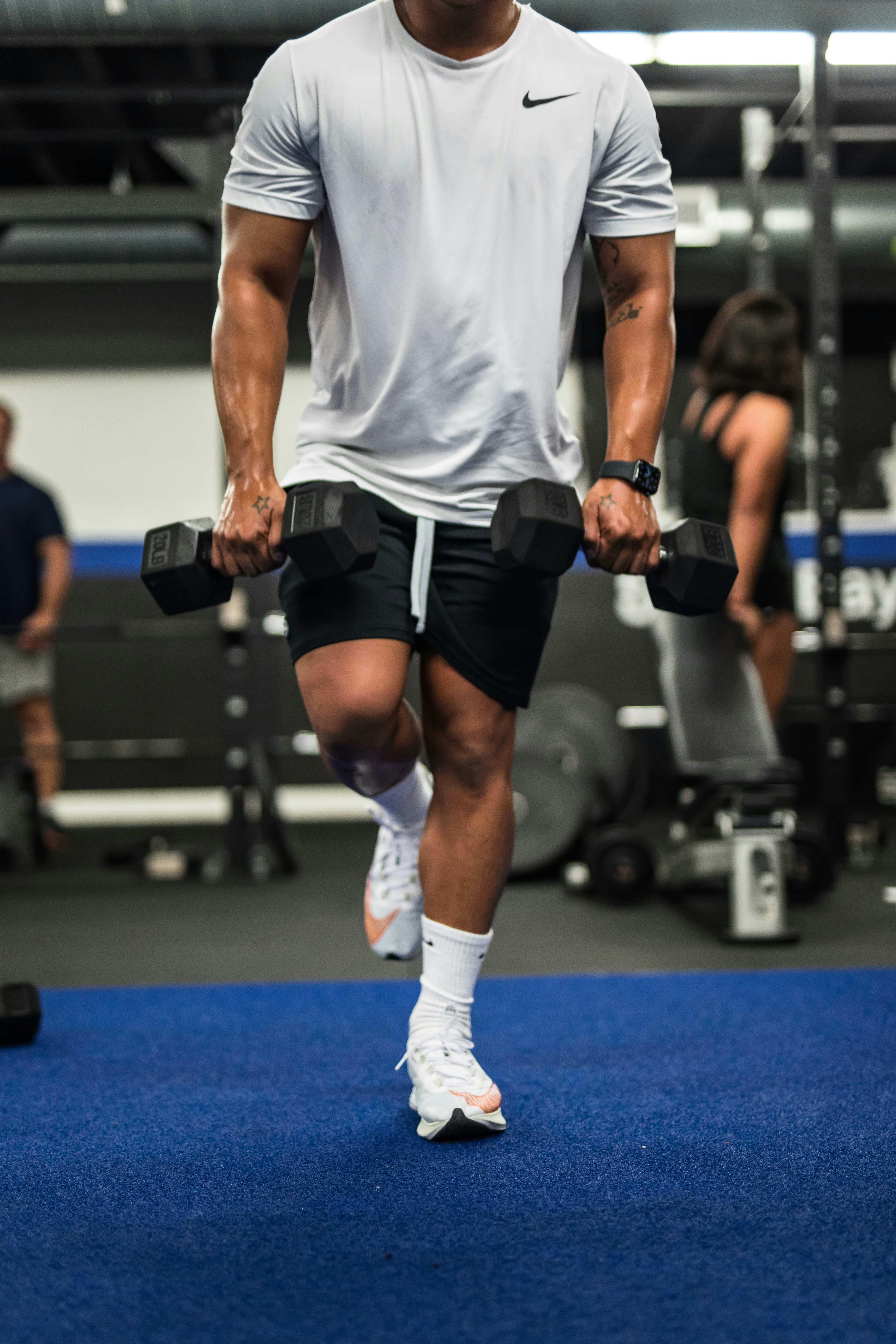 man performing exercise with 2 dumbbells